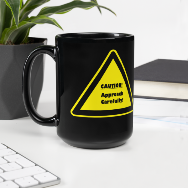 "Caution" Black Glossy Mug